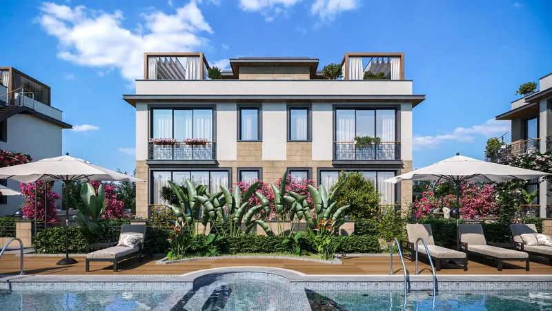 A Floral Homes block seen across the pool, with sun loungers and parasols in the foreground