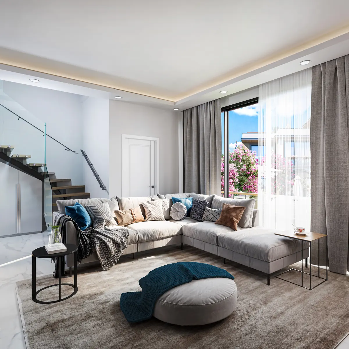 Duplex living room with a floating oak staircase and glass balustrade, a corner sofa and doors to a balcony with bougainvillea